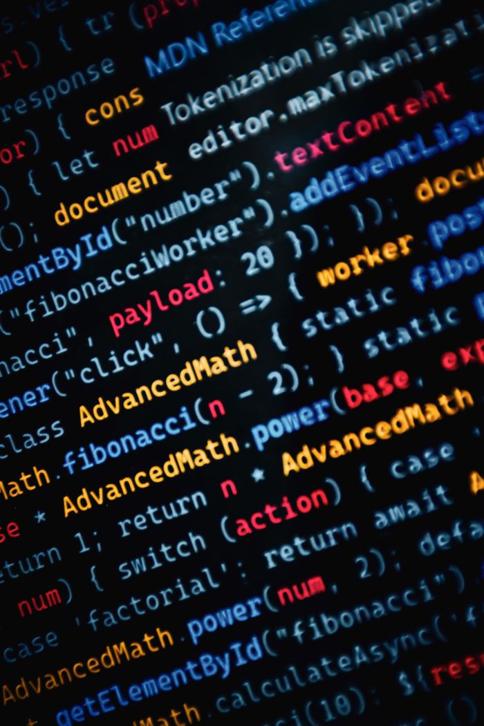 stats-img Close-up of vibrant JavaScript code displayed on a monitor showcasing web development.